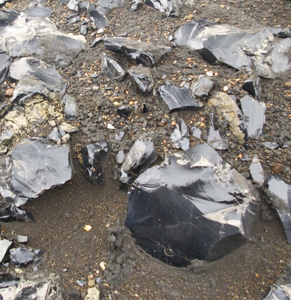 The area near the campsite is littered with glassy black obsidian.